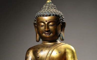 A Chinese Gilt Bronze Figure of Sited Buddha