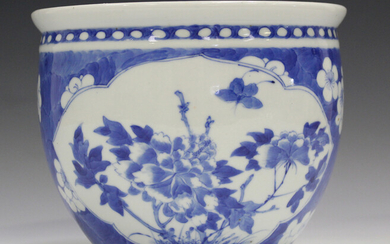 A Chinese blue and white porcelain jardinière, late 19th century, painted with opposing peony panel