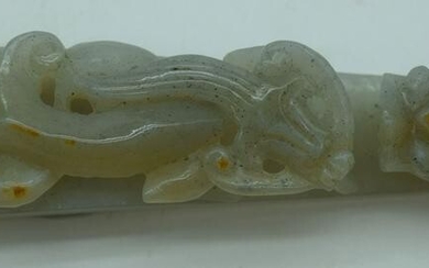 A Chinese carved Jade belt buckle in the form of a