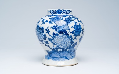 A Chinese crackle glazed blue and white vase with a bird among blossoming branches, 19th...