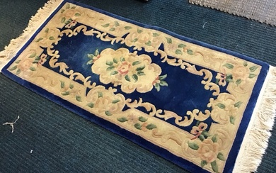 A Chinese wool aubusson style rug with floral medallion on...