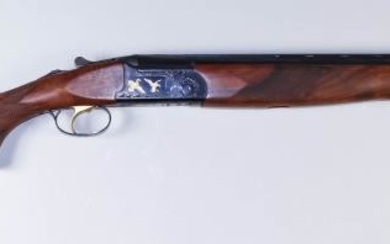 A Current Model 20 Bore Over and Under Shotgun,...