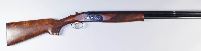 A Current Model 20 Bore Over and Under Shotgun,...