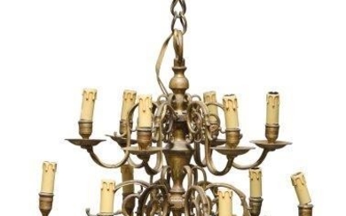 A Dutch twelve light brass chandelier, in...