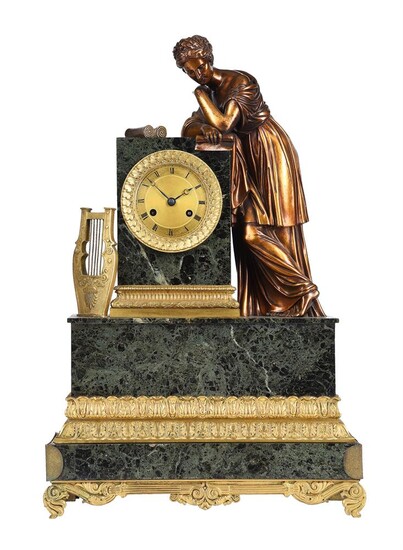 A FRENCH EMPIRE ORMOLU AND VERDE ANTICO MARBLE FIGURAL MANTEL CLOCK