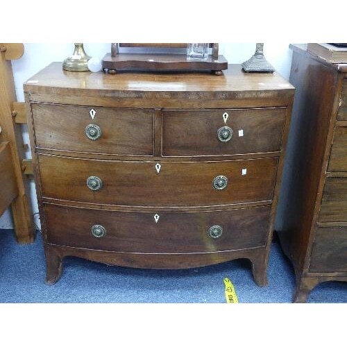 A George III mahogany bow-front Chest-of-Drawers, two short ...
