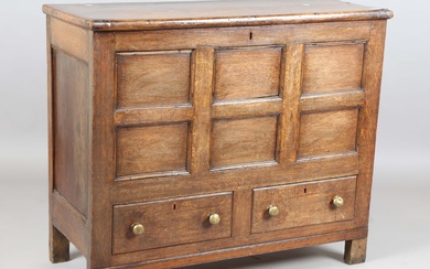 A George III provincial oak mule chest, the removable lid above a panelled front and two drawers, he
