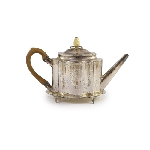 A George III silver bright cut engraved oval teapot and stan...