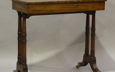 A George IV figured mahogany rectangular side table, raised on reeded sabre legs with brass caps and