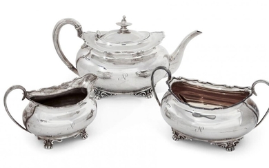 A George V three-piece silver tea set, Sheffield, c.1917 and 1918, Atkin Brothers, of rectangular form with shaped rims to reeded handles, the body of each raised on four bracket feet and engraved with the letter 'N', total weight approx. 35oz (3)