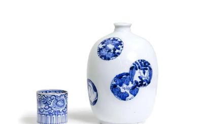 A Japanese blue and white bottle vase and a cup Edo period,...