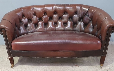 A LEATHER BUTTON BACK LOUNGE