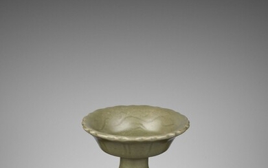 A LONGQUAN CELADON ‘BAMBOO’ BARBED-RIM STEM CUP, YUAN TO EARLY MING