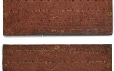 A PAIR OF CARVED WOOD AND POLYCHROME BOOK COVERS Tibet, 14th/15th Century