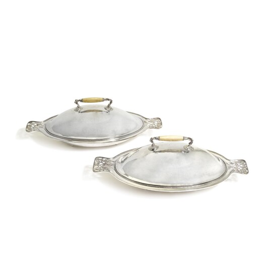 A PAIR OR GUILD OF HANDICRAFT SILVER-PLATED COPPER VEGETABLE DISHES AND COVERS, DESIGNED BY C. R. ASHBEE, CIRCA 1900