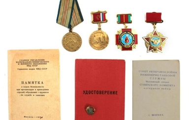A RUSSIAN SOVIET MEDALS AND BADGE WITH DOCUMENTS