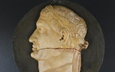 A Roman black marble and giallo di Siena medallion