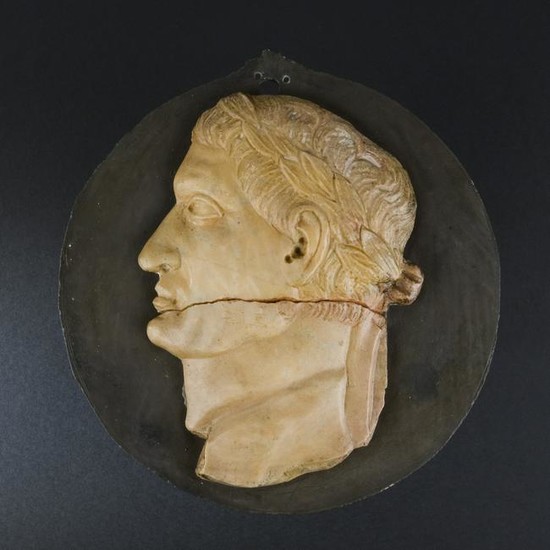 A Roman black marble and giallo di Siena medallion