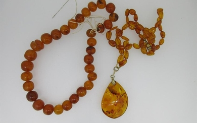 A Russian amber pendant on necklace together with a