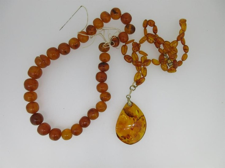 A Russian amber pendant on necklace together with a