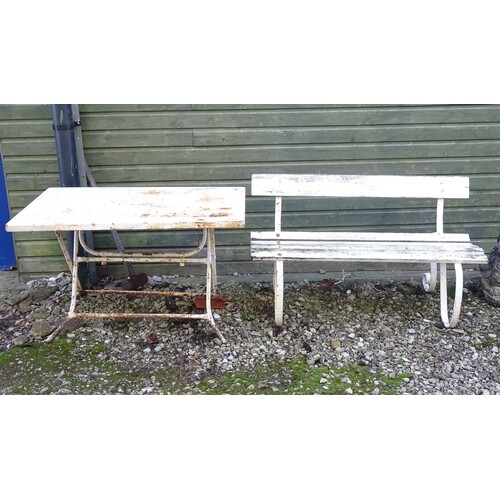 A Victorian garden bench with wrought iron mounts and wooden...