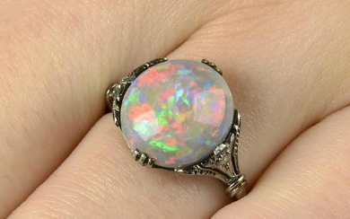 A black opal and rose-cut diamond accent ring.Opal