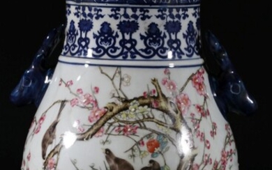 A blue and white twin handled Chinese vase, decorated with butterlfies and birdsH: 29cm