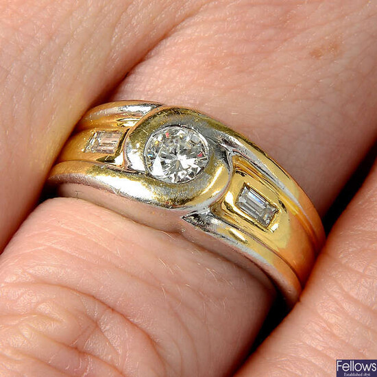 A brilliant and baguette-cut diamond bi-colour dress ring.