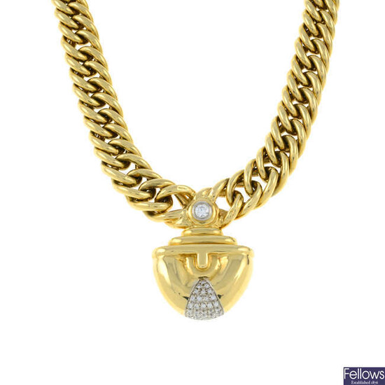 A brilliant-cut diamond pendant, on integral chain.