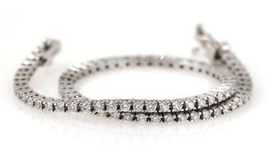 A diamond bracelet set with numerous diamonds weighing a total of app....