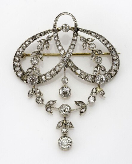 A diamond brooch/pendant, in the garland style millegrain set with circular- and rose-cut diamonds, two rose-cut diamonds deficient, c.1900