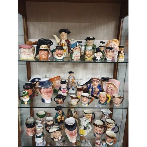 A extremely large collection of Toby Jugs some Royal Doulton...