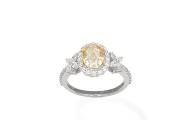 A fancy coloured diamond and diamond ring