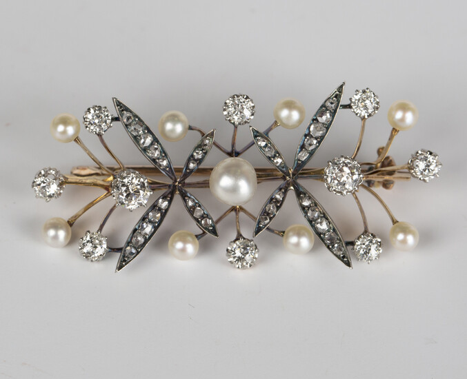 A gold backed and silver set, diamond and cultured pearl brooch in a twin spray design, mounted with
