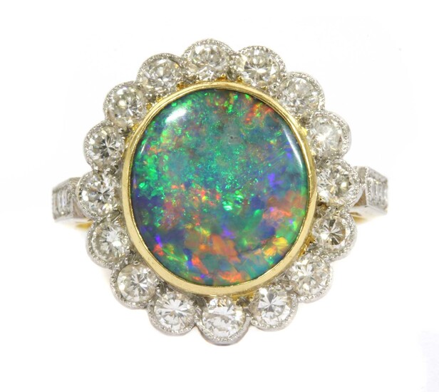A gold boulder opal and diamond cluster ring