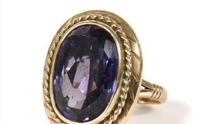 A gold synthetic colour change sapphire ring
