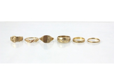 A group of six yellow metal rings, including a 9ct yellow go...
