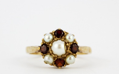 A hallmarked 9ct yellow gold ring pearl and garnet set ring, (N).