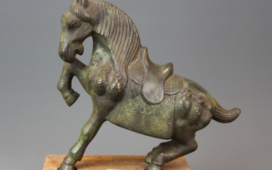 A heavy patinated Chinese bronze figure of a horse on a carved wooden base, overall H. 24cm.