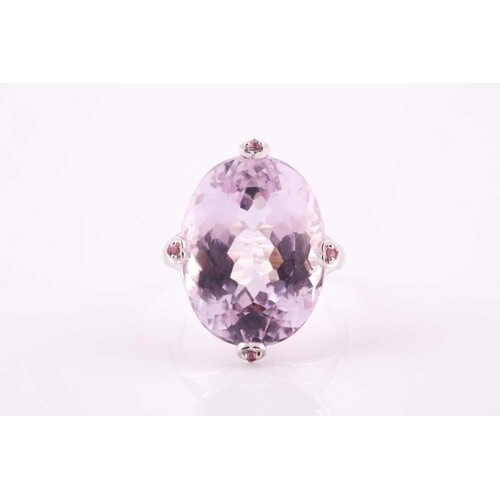 A kunzite and pink sapphire cocktail ring, set with a large ...