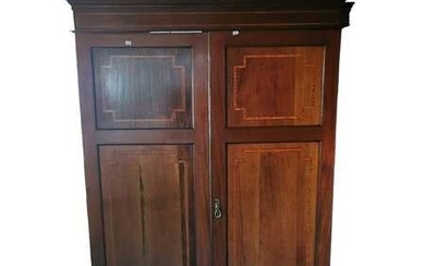 A large Edwardian mahogany inlaid double wardrobe fitted on one...