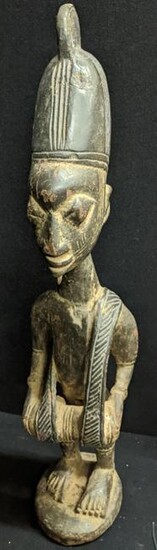 A large West African tribal wooden drummer