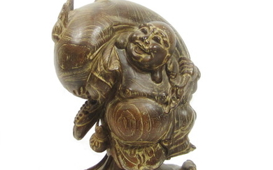 A large wood figure of Hotei