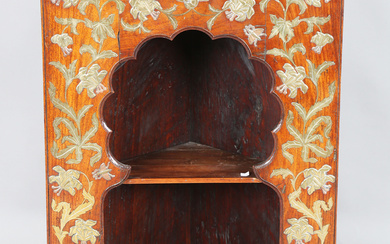 A late 19th century Aesthetic Movement Moorish walnut corner display shelf, the arched niche fitted