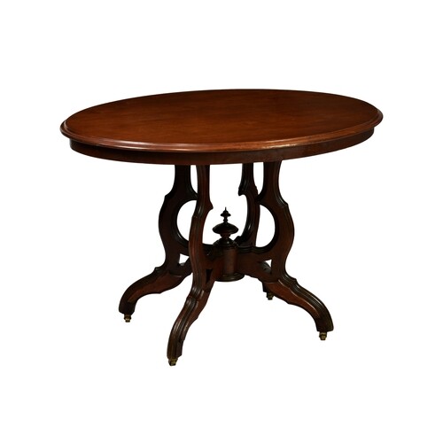 A late Victorian oval walnut centre table, the moulded top r...