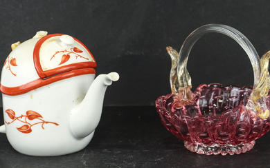 A lovely art glass basket in pink with pulled handle...