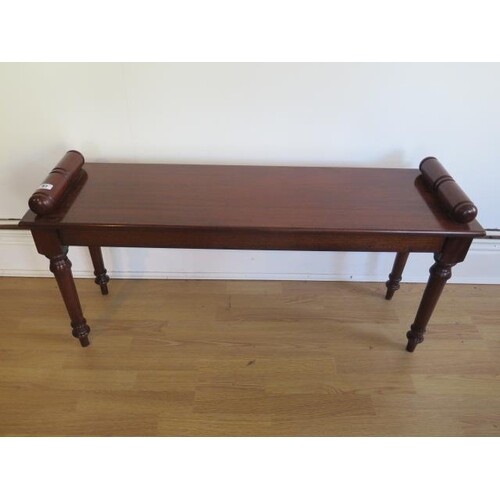 A mahogany window seat on well turned legs made by a local c...