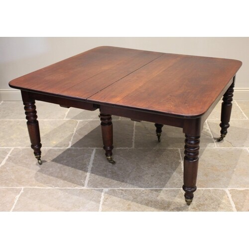 A mid 19th century mahogany extending dining table, the rect...