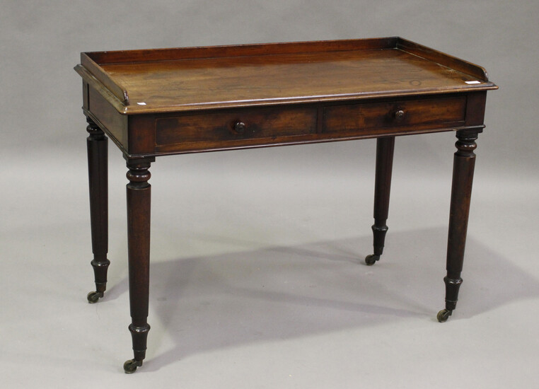 A mid-Victorian mahogany side table, possibly by Gillows of Lancaster, fitted with two oak-lined dra