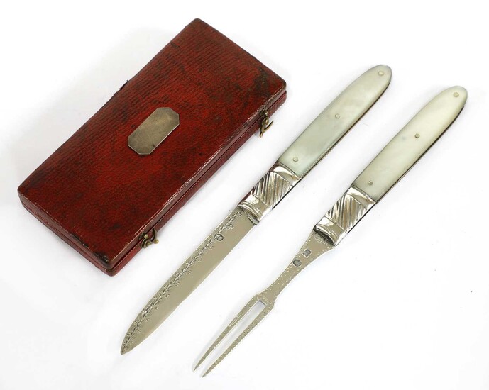 A mother-of-pearl and silver folding fruit knife and fork set